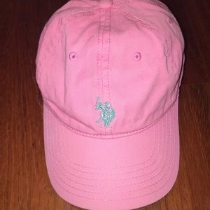 pink with blue logo polo hat, slightly worn